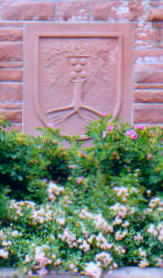Town Seal Above A Bed Of Flowers